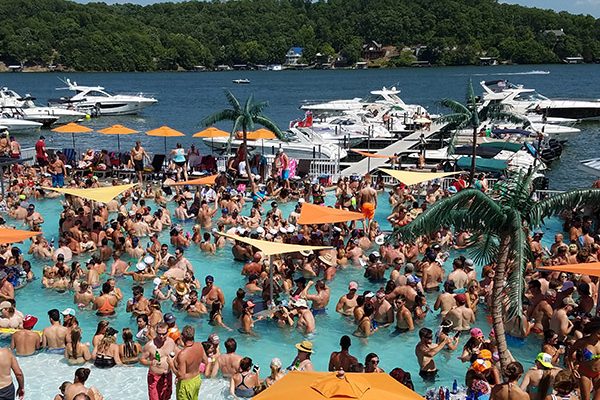 Adults partying at Coconuts Caribbean Beach Bar & Grill, one of the most popular water front pool bars at Lake of the Ozarks.