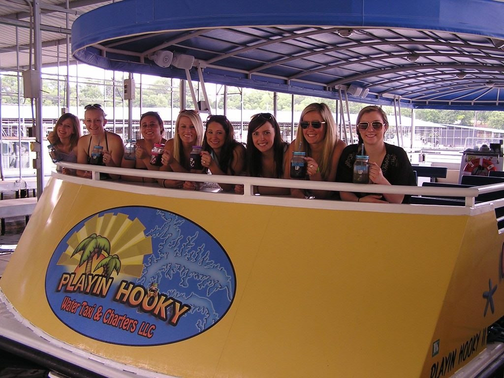 Boat Taxi Lake of the Ozarks A group of young women excited to use our boat taxi Lake of the Ozarks service to get to their destination.